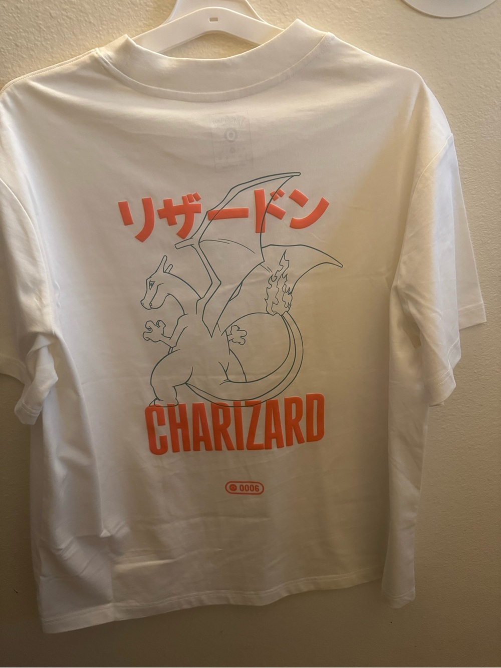 Pokemon White Short Sleeve Charizard Tee with Orange Graphics